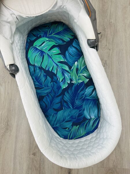 Ratu paladziņš ar gumiju - zaļas lapas uz zila fona